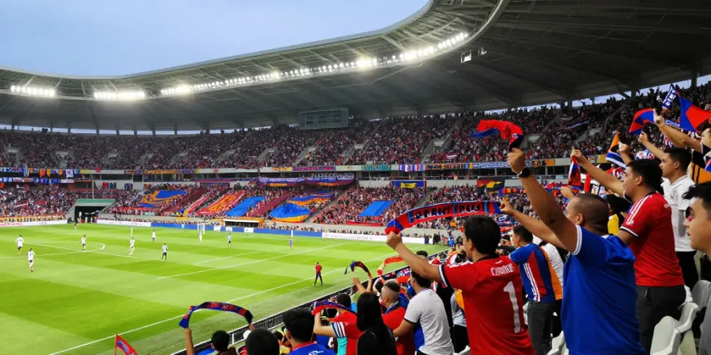 ข่าวซื้อขายนักเตะ enthusiastically supported by fans at a vibrant football stadium.